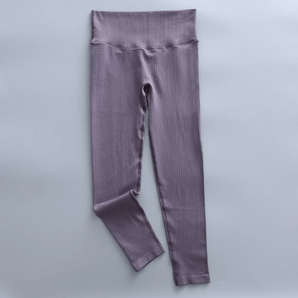 Sports seamless high waist ribbed leggings for women in purple, ideal for yoga and exercise, crafted with nylon and spandex for comfort.